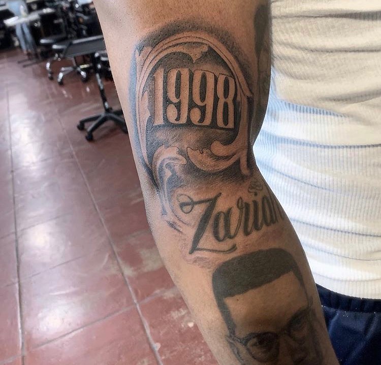 Tattoo by @longbeachskinportfolio — lettering_script, black_and_grey