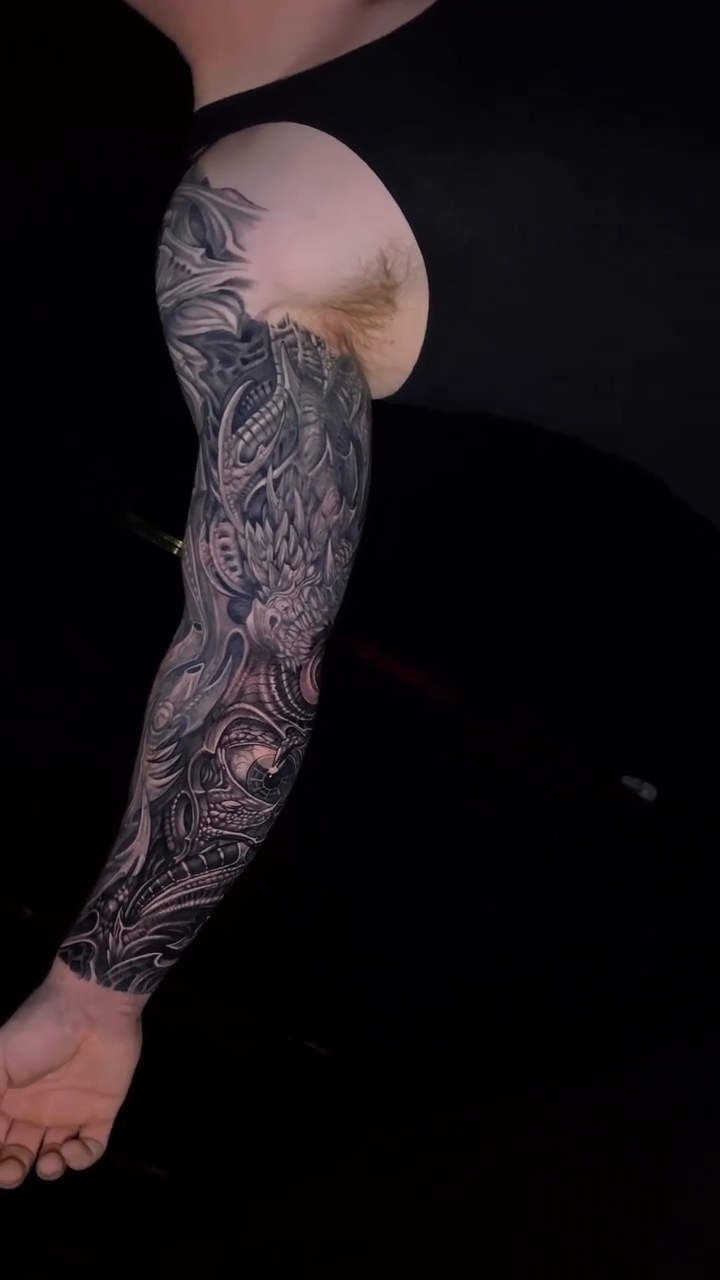 Tattoo by @john.alaw.tattoo — dark_realism, black_and_grey