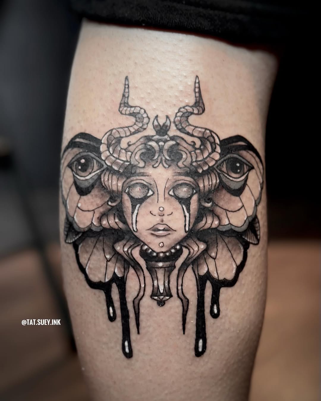 Tattoo by @tat.suey.ink — dark_realism, blackwork