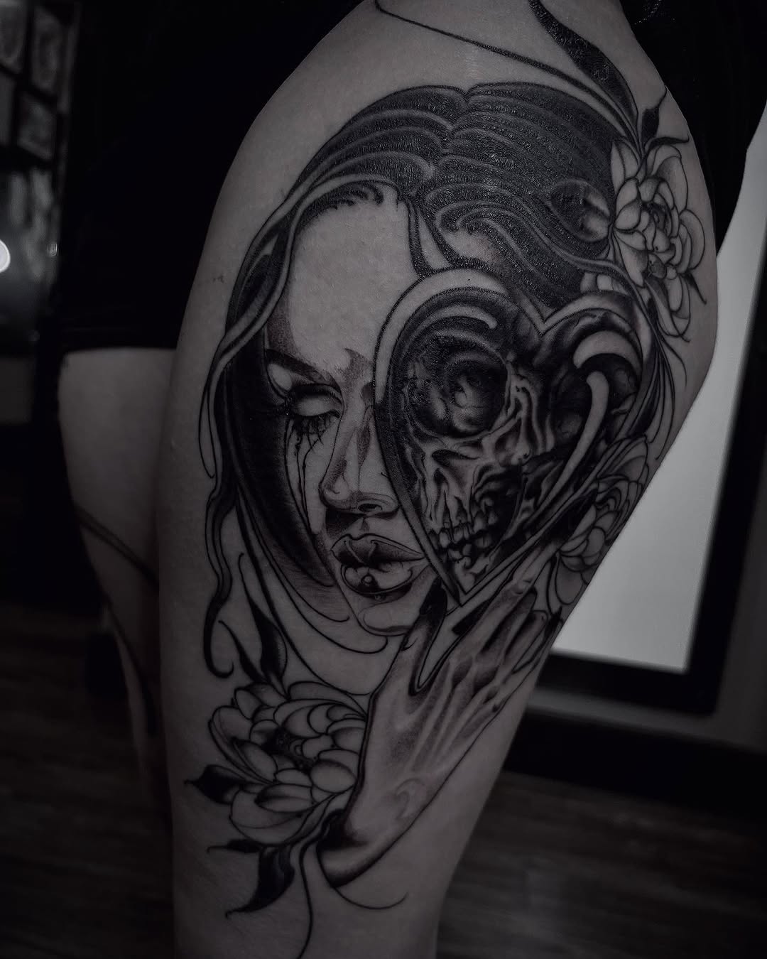 Tattoo by @lorenzotattoos — dark_realism, black_and_grey