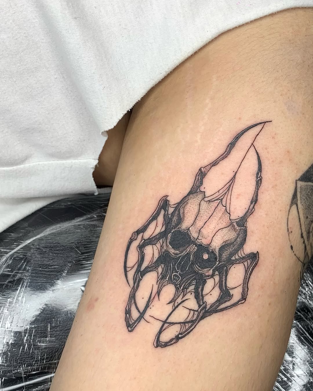 Tattoo by @gf.tattookorat — dark_realism, black_and_grey