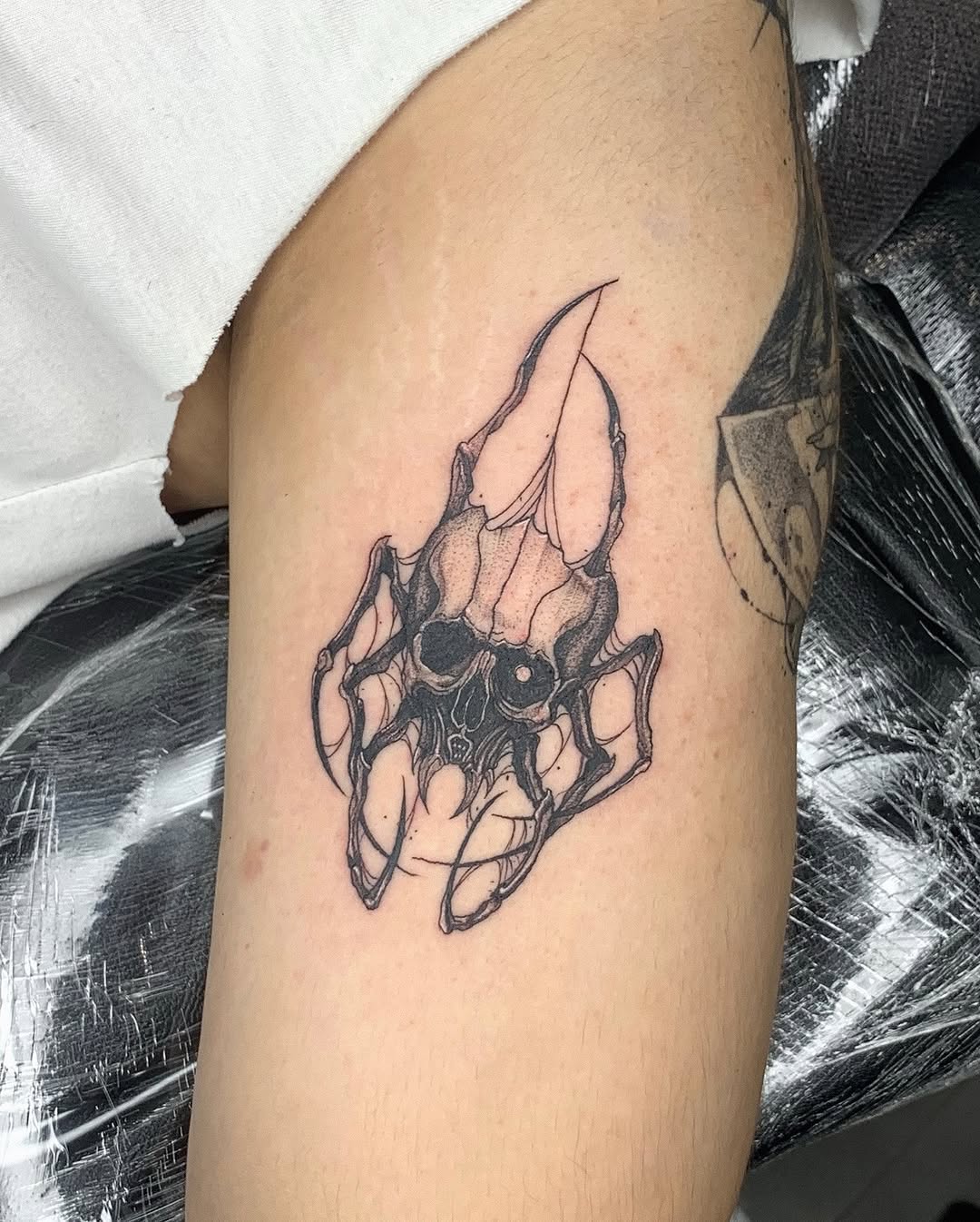 Tattoo by @gf.tattookorat — dark_realism, black_and_grey