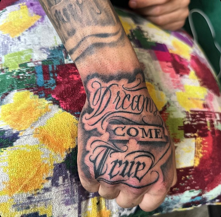 Tattoo by @merlin_inktattoo237 — lettering_script, black_and_grey
