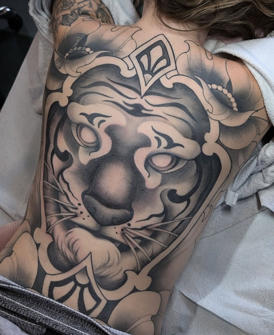 Tattoo by @jainagoldtattoos — black_and_grey, realism