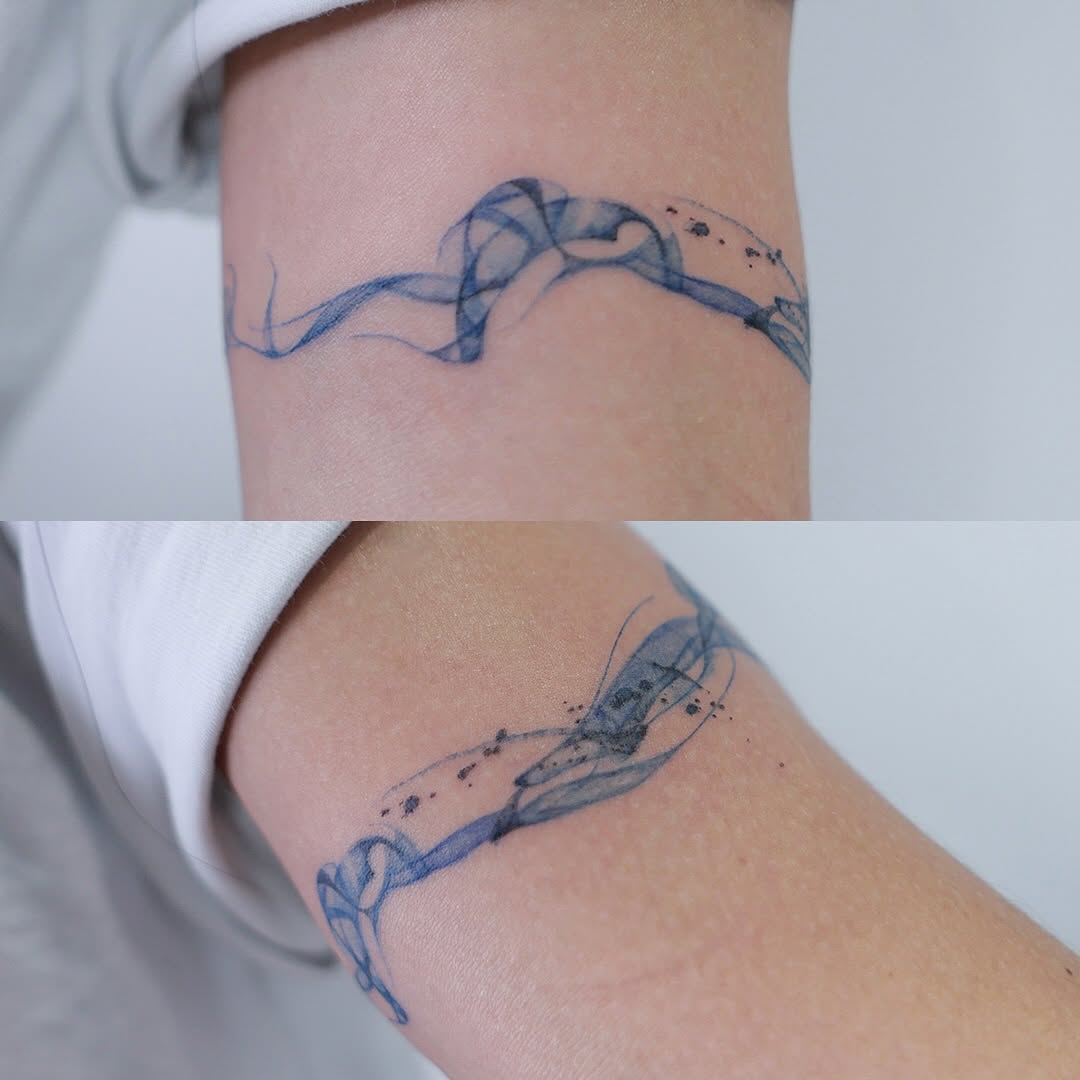 Tattoo by @dowha.tt — watercolor, fine_line
