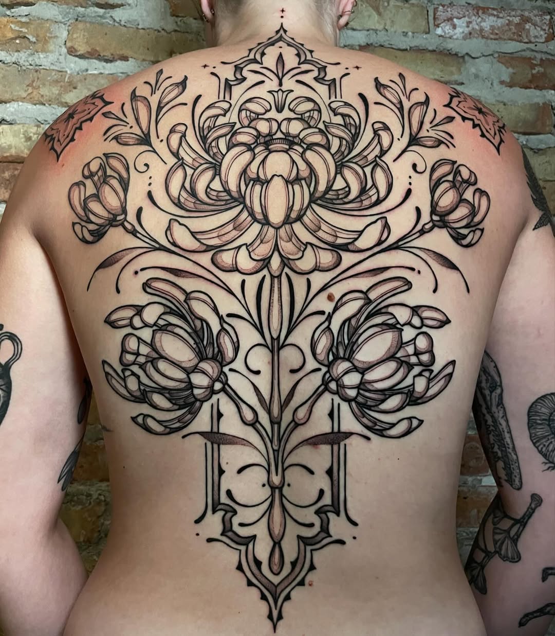 Tattoo by @strangegraves.ink — illustrative, ornamental