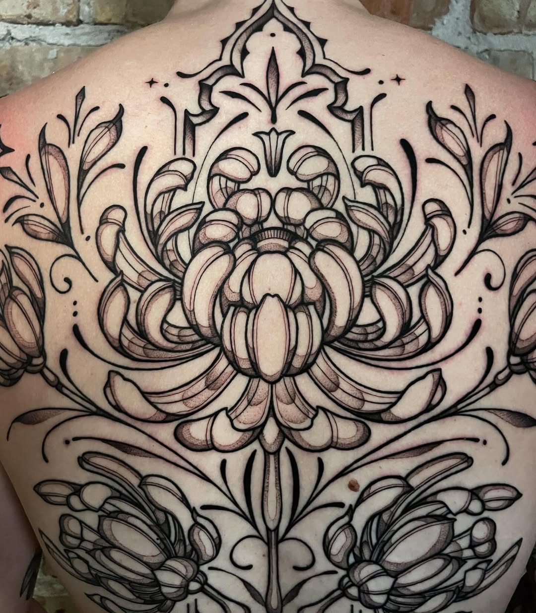 Tattoo by @strangegraves.ink — ornamental, black_and_grey
