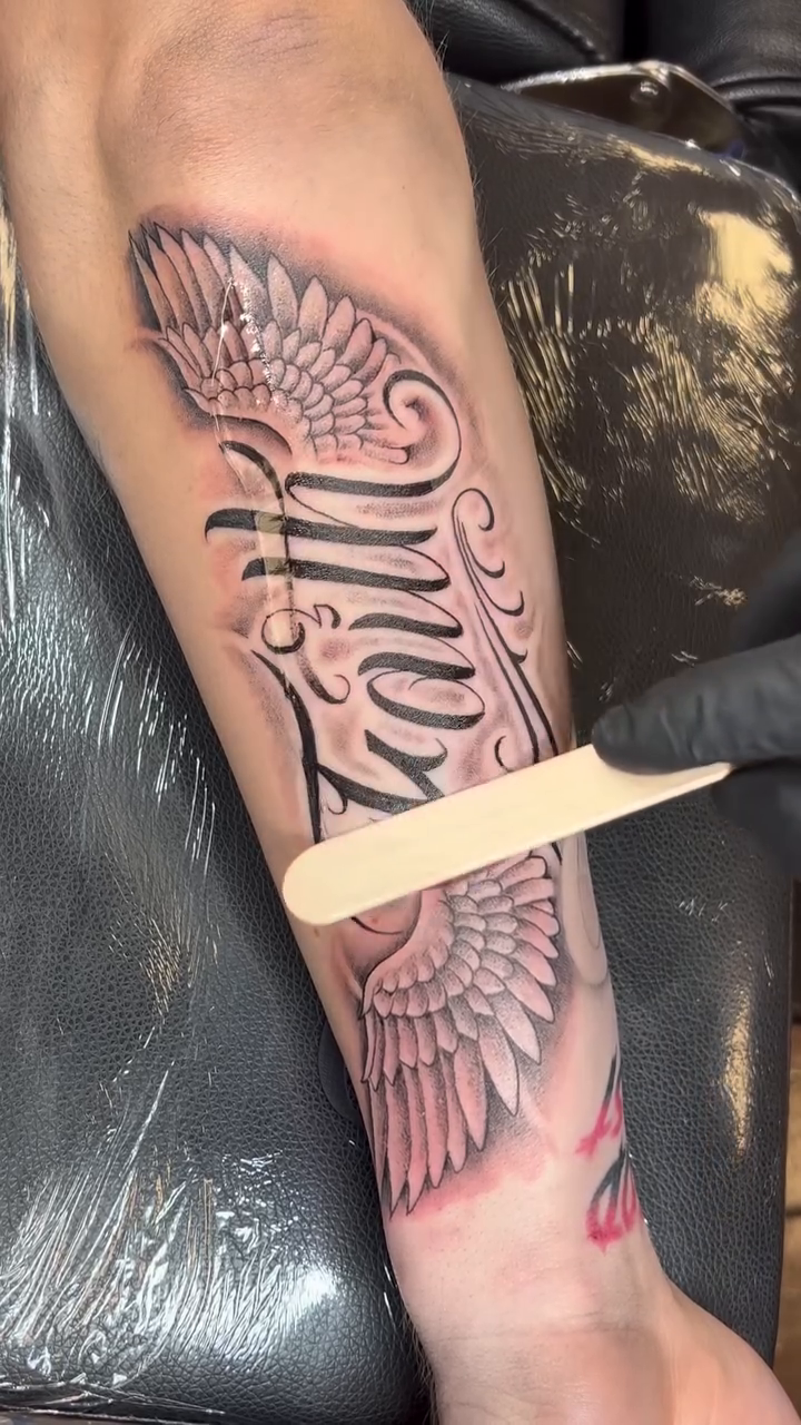 Tattoo by @villionairetattoos — lettering_script, black_and_grey