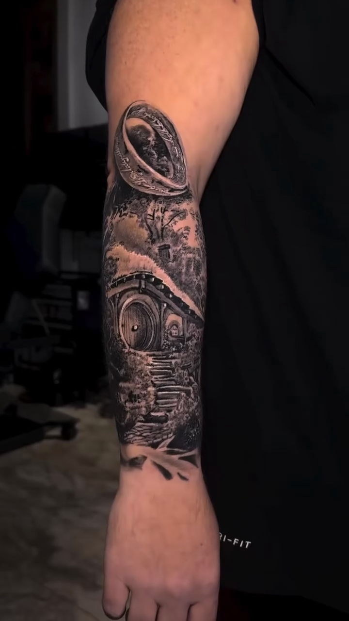 Tattoo by @grimlayertattoo — realism, black_and_grey