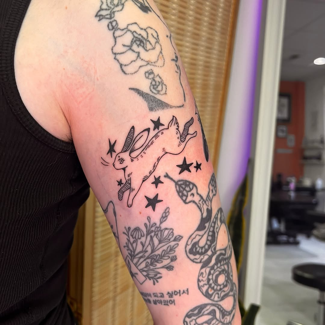 Tattoo by @rae.inkss — illustrative, blackwork