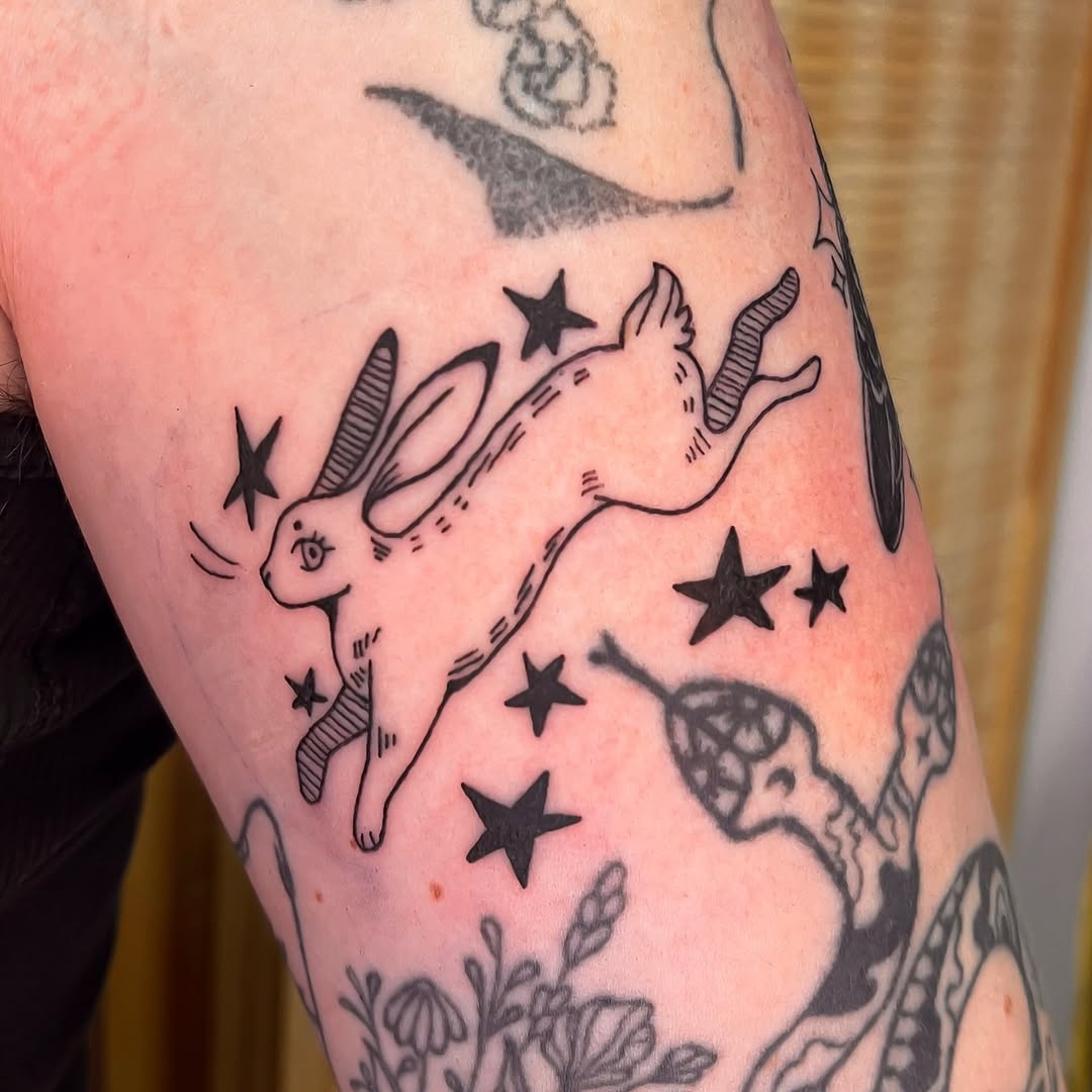 Tattoo by @rae.inkss — illustrative, blackwork