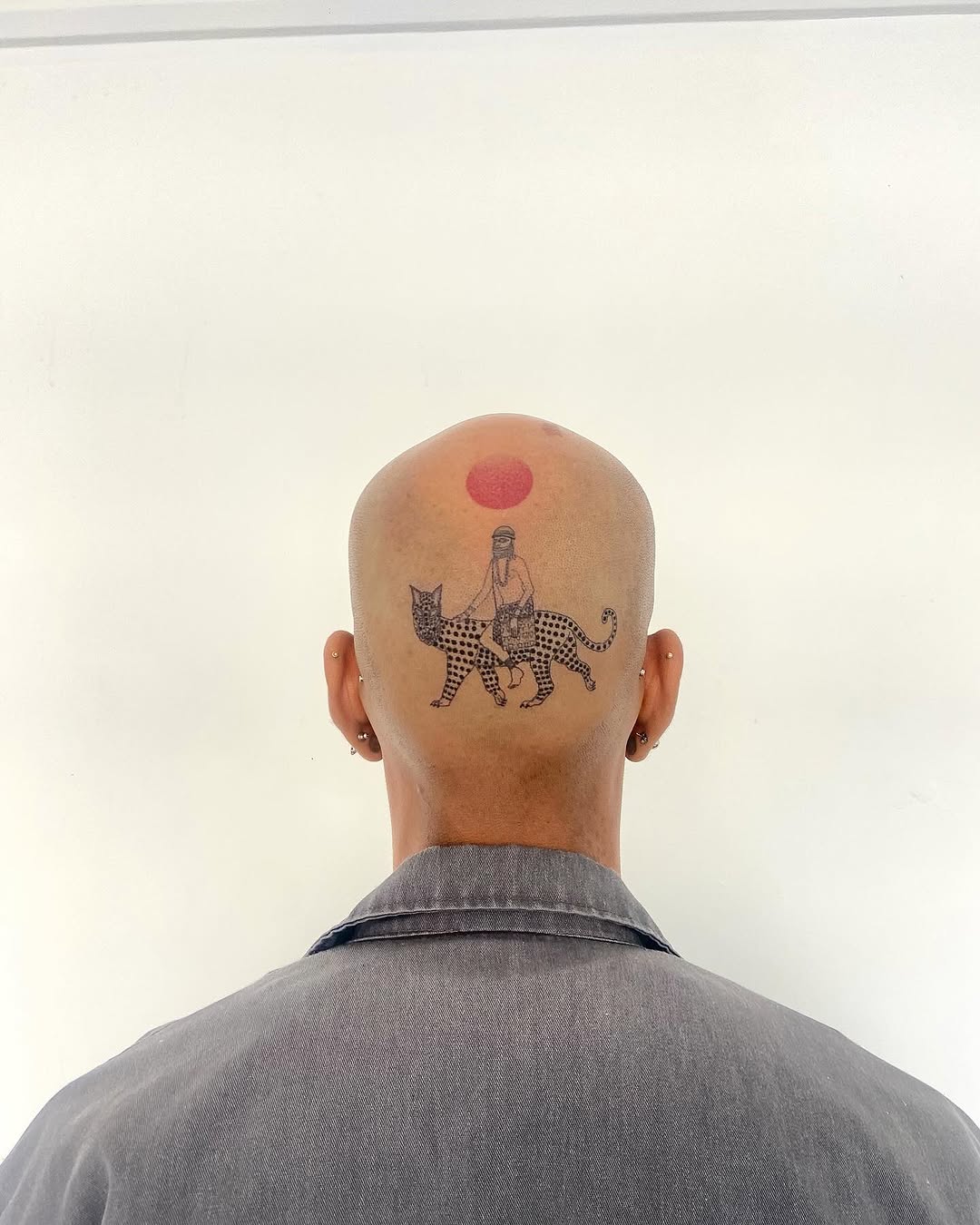 Tattoo by @geisha_ocelotl — illustrative, dotwork