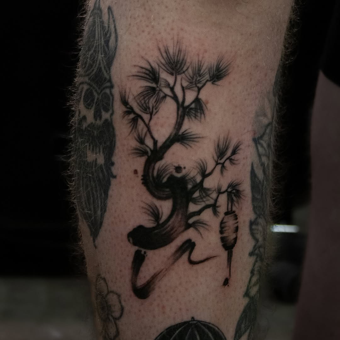 Tattoo by @oolong.ink — black_and_grey, illustrative