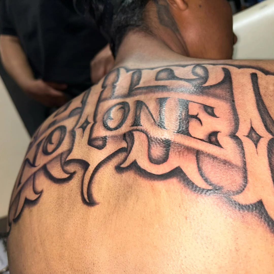 Tattoo by @tusanchotattoos_lv โ lettering_script, blackwork