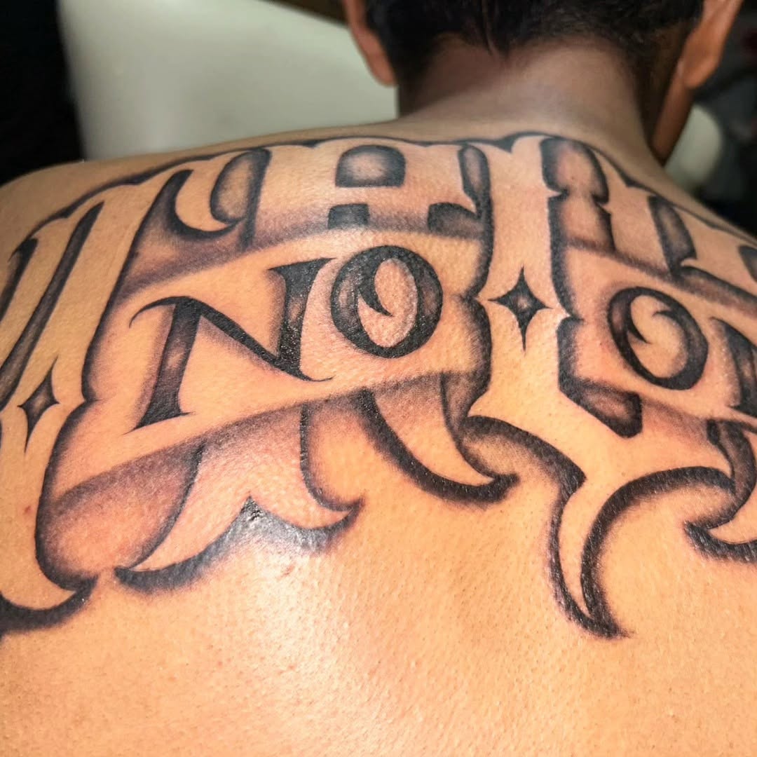 Tattoo by @tusanchotattoos_lv โ lettering_script, blackwork