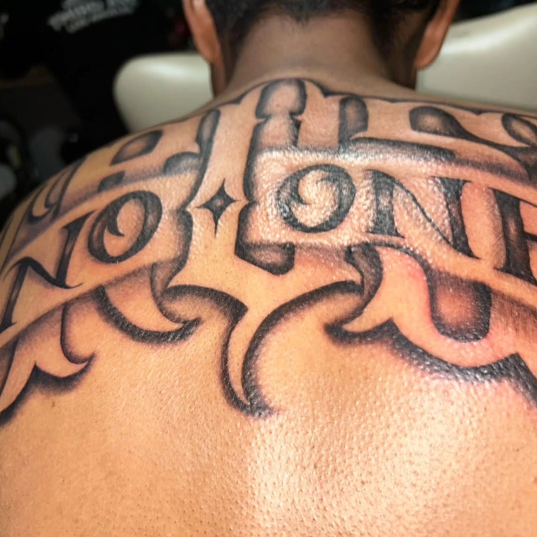 Tattoo by @tusanchotattoos_lv โ lettering_script, blackwork