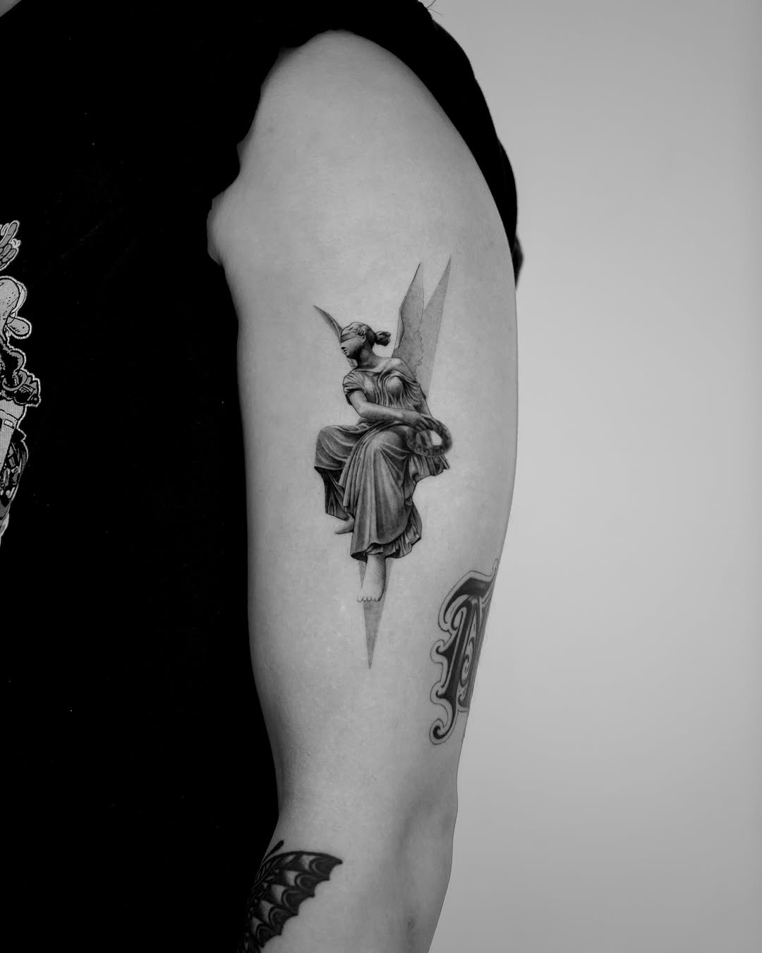 Tattoo by @lai.ink_ — black_and_grey, realism