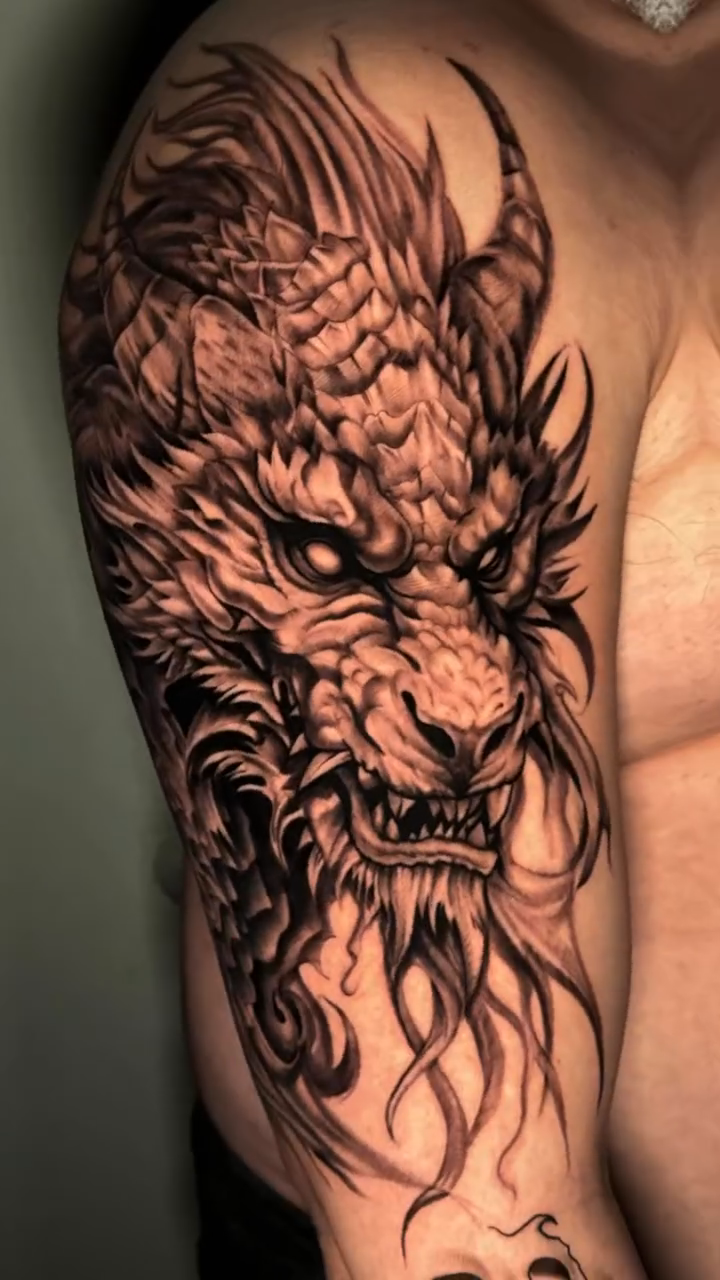 Tattoo by @kodi_tattoo — realism, black_and_grey