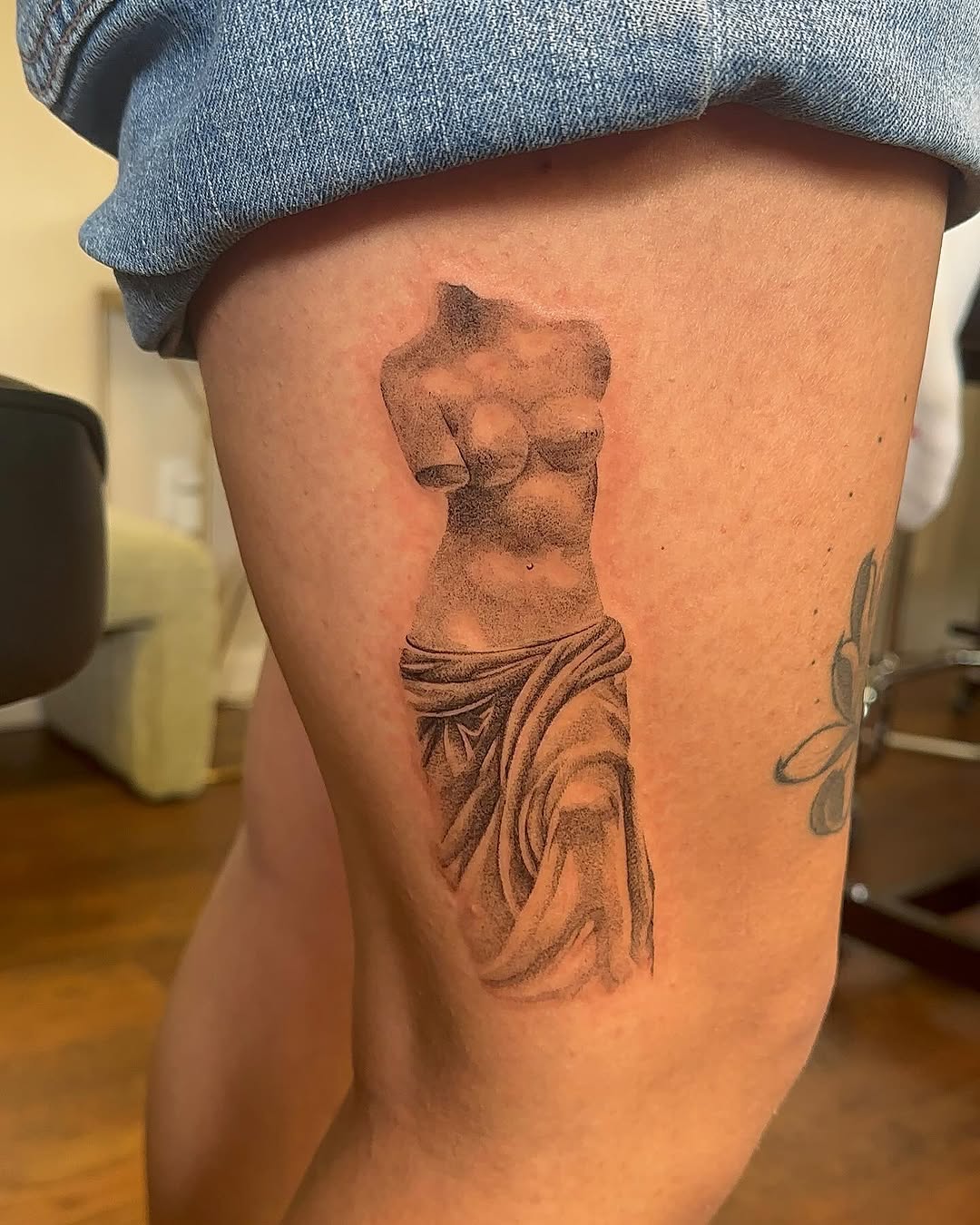 Tattoo by @bboujeeink2 — black_and_grey, realism
