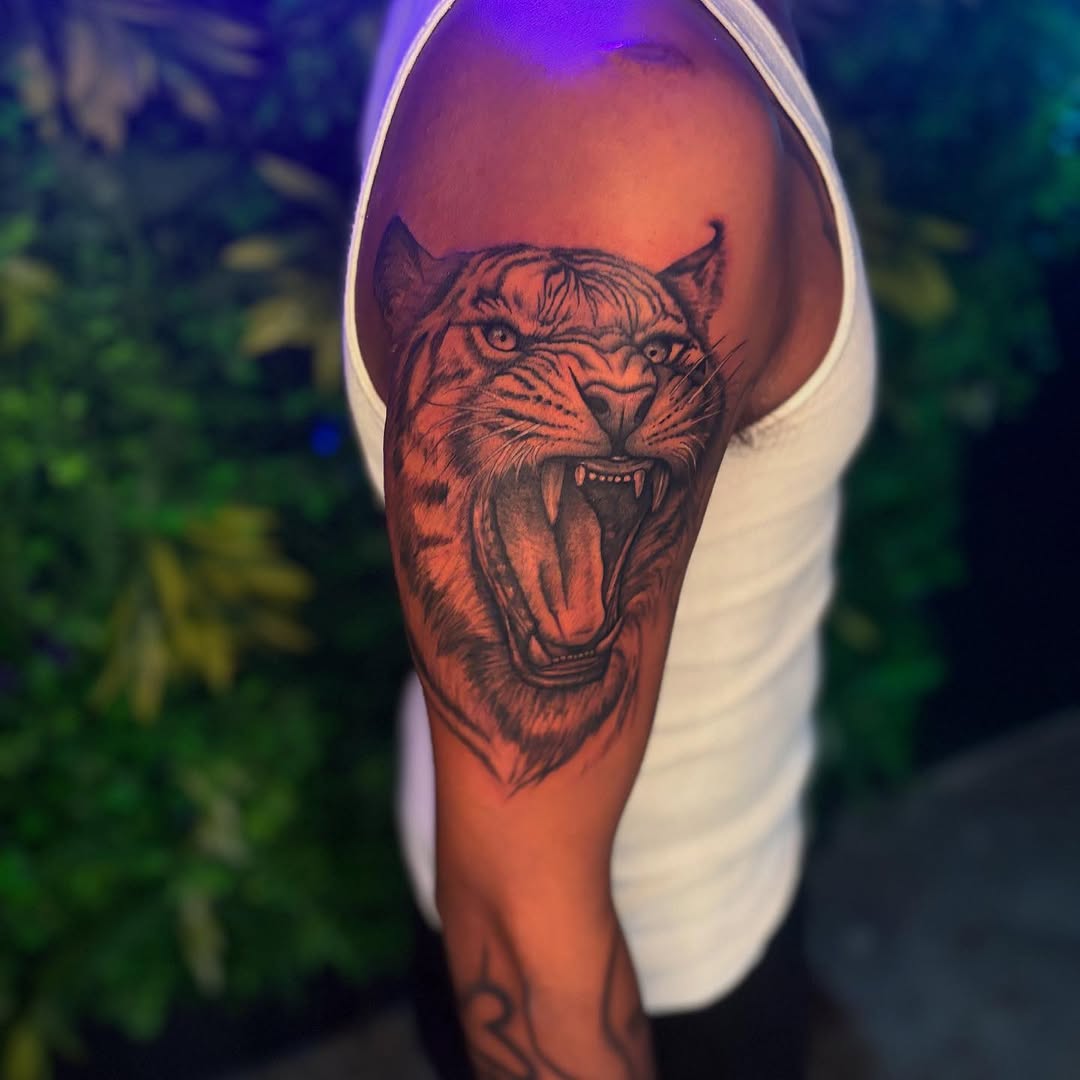 Tattoo by @inked.by.kiwiii โ realism, black_and_grey