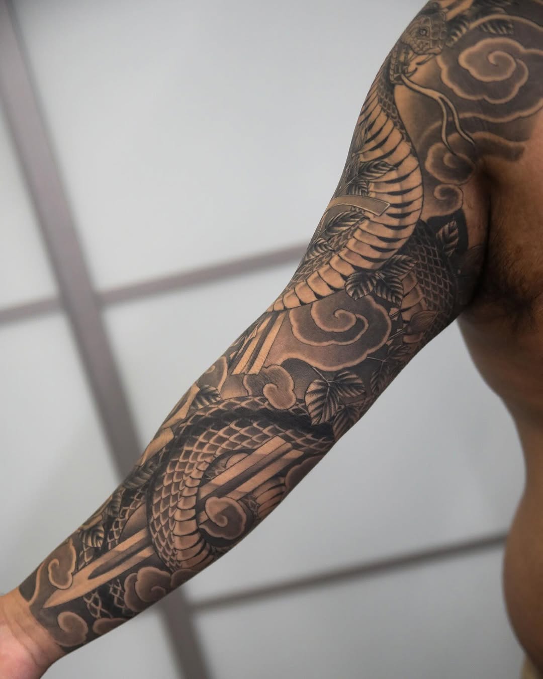 Tattoo by @hunter.schuon.tattoo — japanese_irezumi, black_and_grey