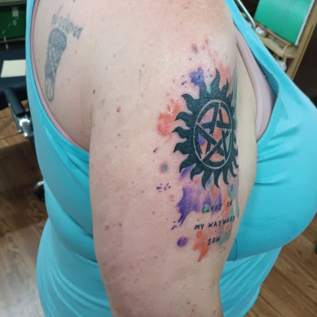 Tattoo by @speedy_tattz — blackwork, watercolor