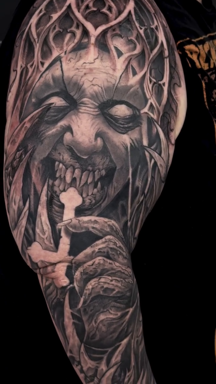 Tattoo by @the_flame_spitta — dark_realism, black_and_grey