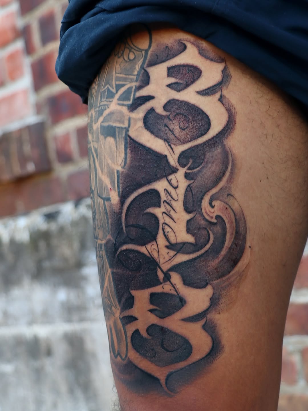 Tattoo by @tat_papi — lettering_script, black_and_grey