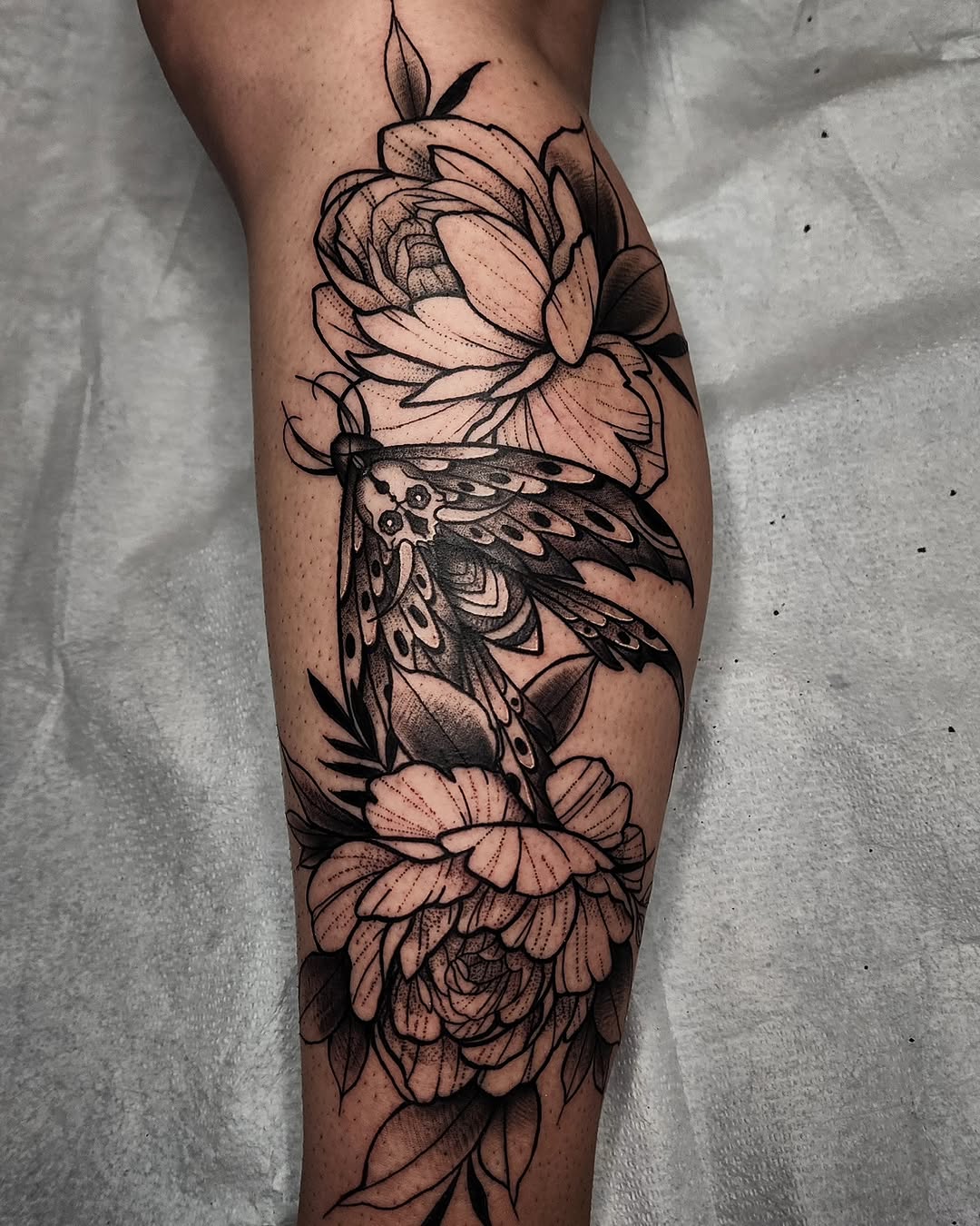 Tattoo by @madx.ink — black_and_grey, fine_line