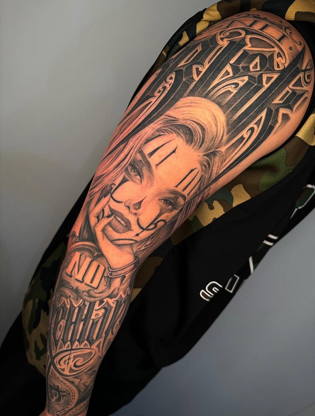 Tattoo by @dopeletterstattoo — chicano, black_and_grey