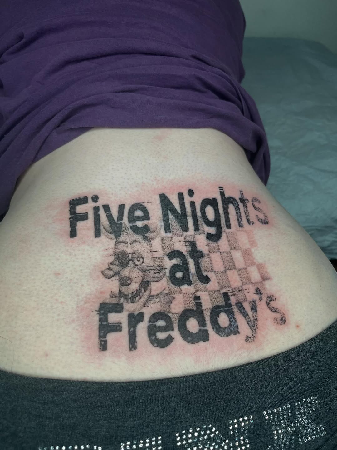Tattoo by @needleshark — lettering_script, blackwork