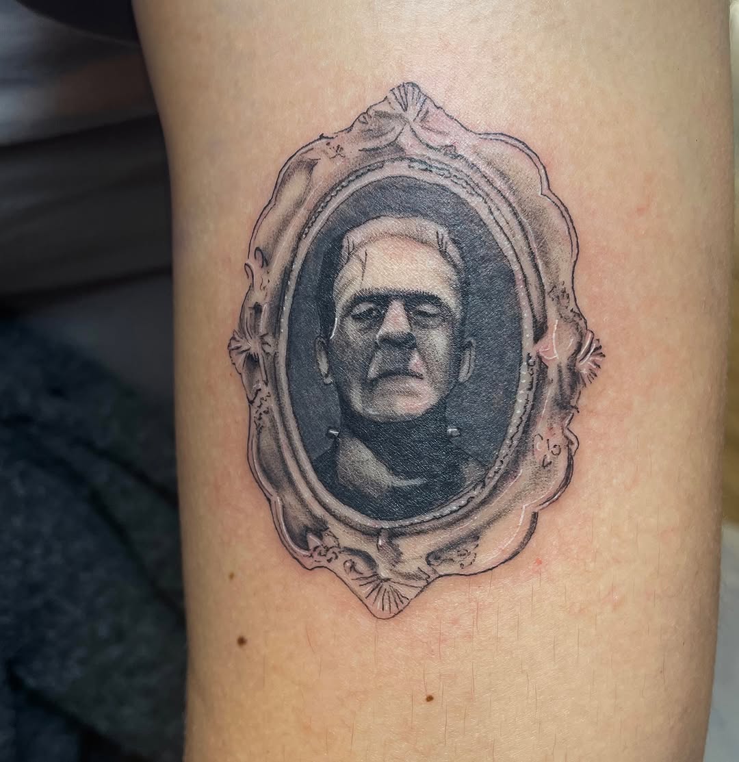 Tattoo by @m3ga.p1xlz — realism, black_and_grey