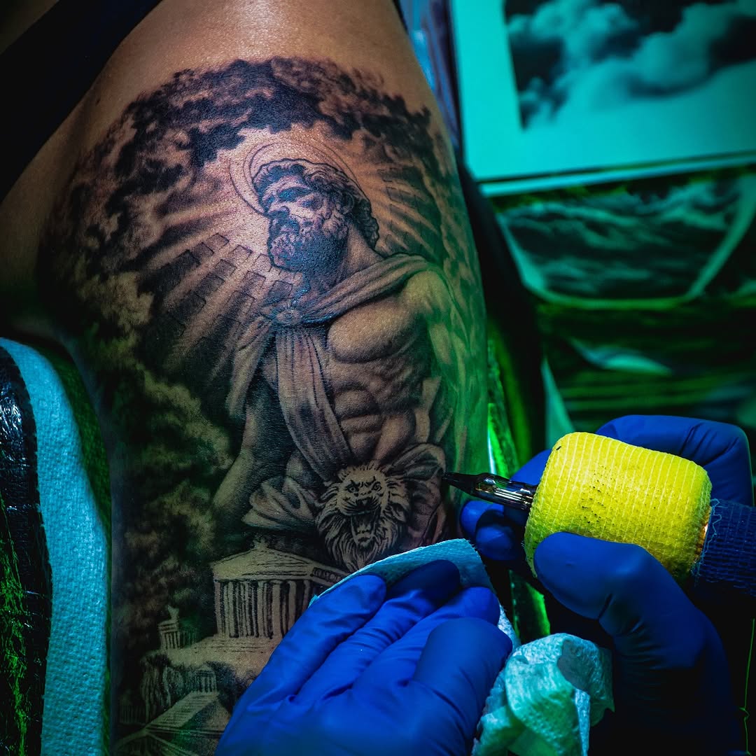 Tattoo by @sherifftattoos — realism, black_and_grey