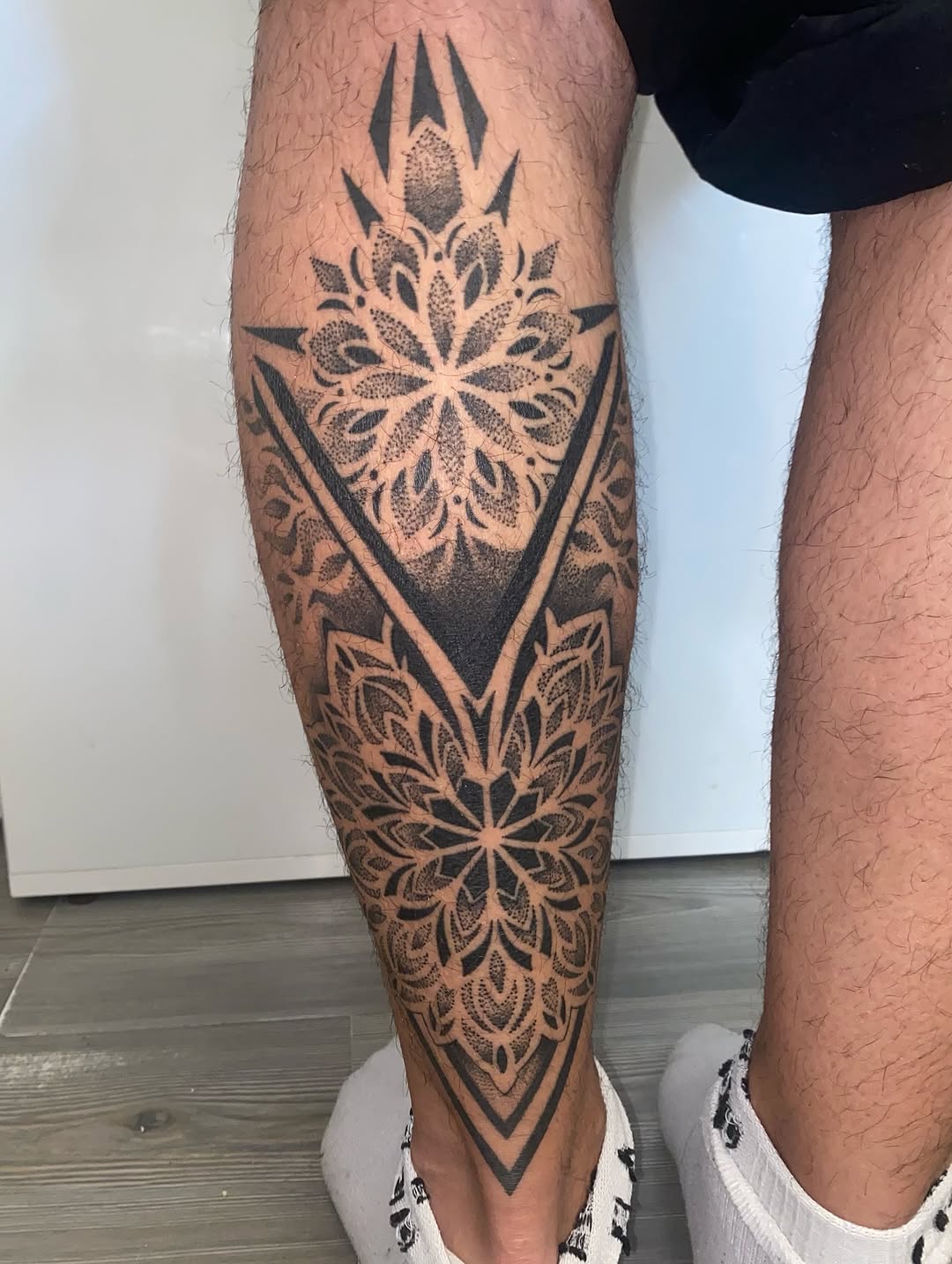 Tattoo by @skins_aj — geometric, dotwork