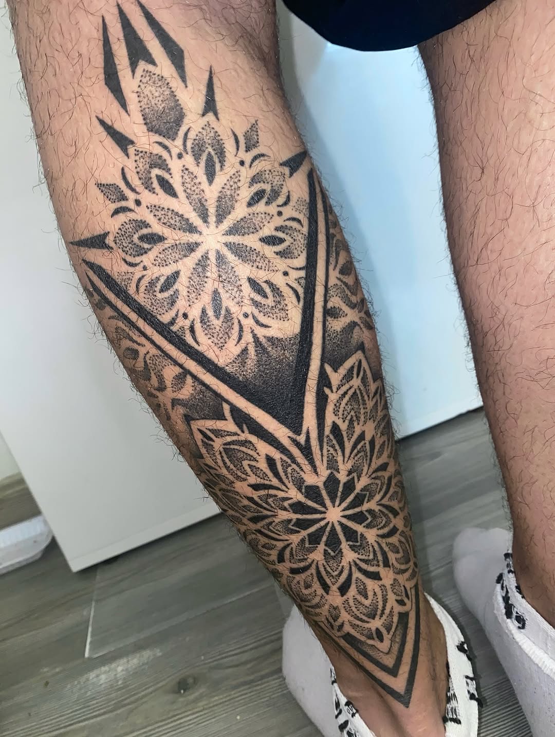 Tattoo by @skins_aj — geometric, dotwork