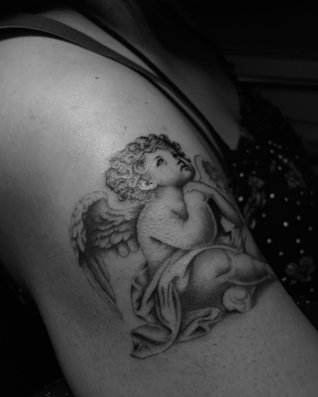 Tattoo by @cvssandra.art — realism, black_and_grey