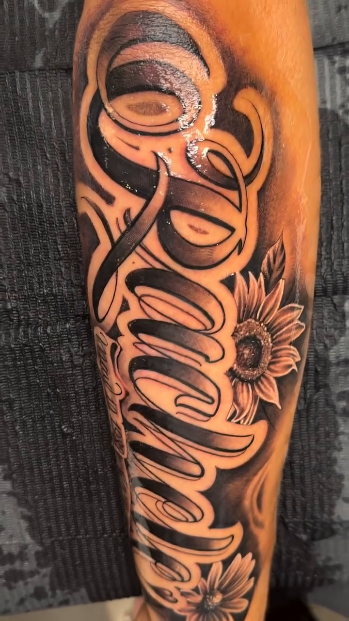 Tattoo by @omarrodrigueztattoo — lettering_script, black_and_grey