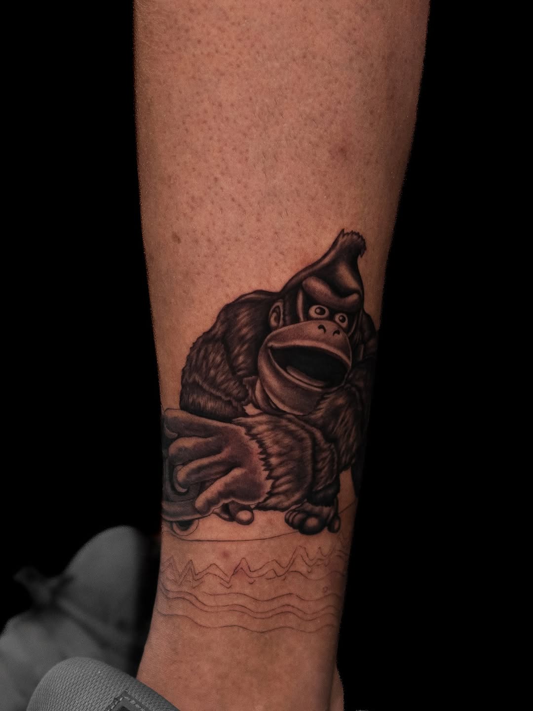 Tattoo by @wenghiskhan_tattoos — realism, black_and_grey