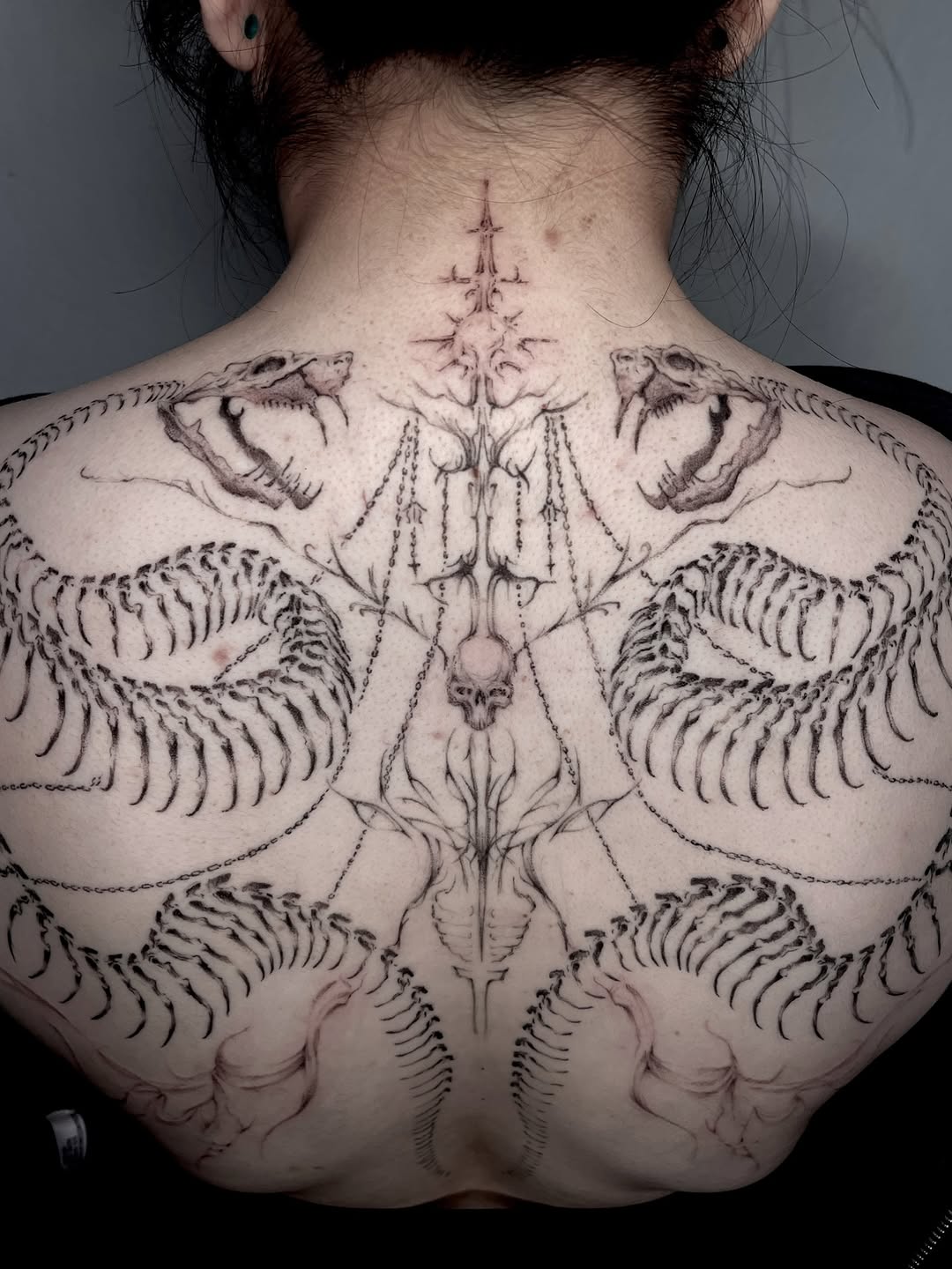 Tattoo by @rayzhu.tattoo — black_and_grey, dark_realism