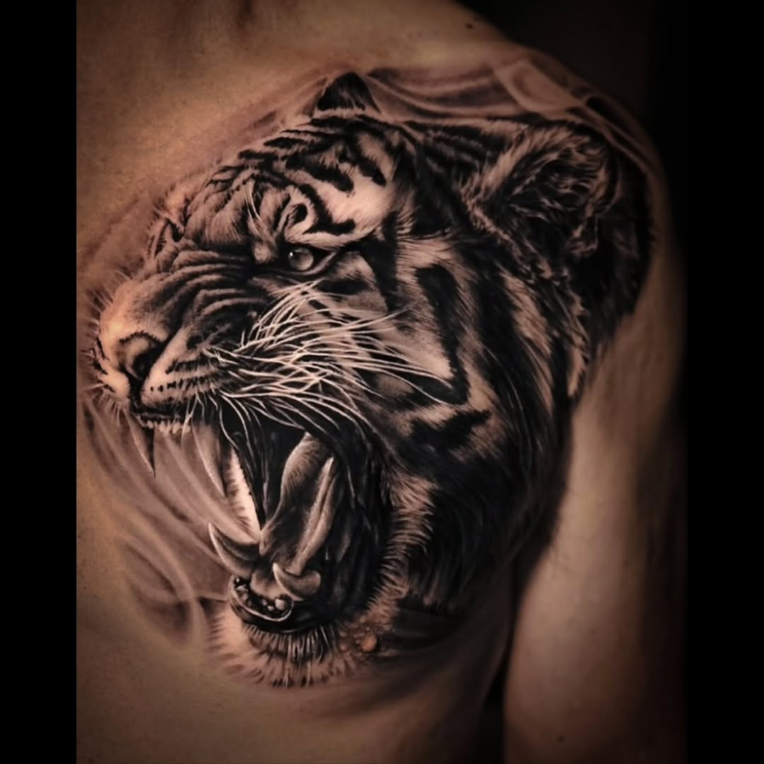 Tattoo by @tattooist_pitasso — realism, black_and_grey