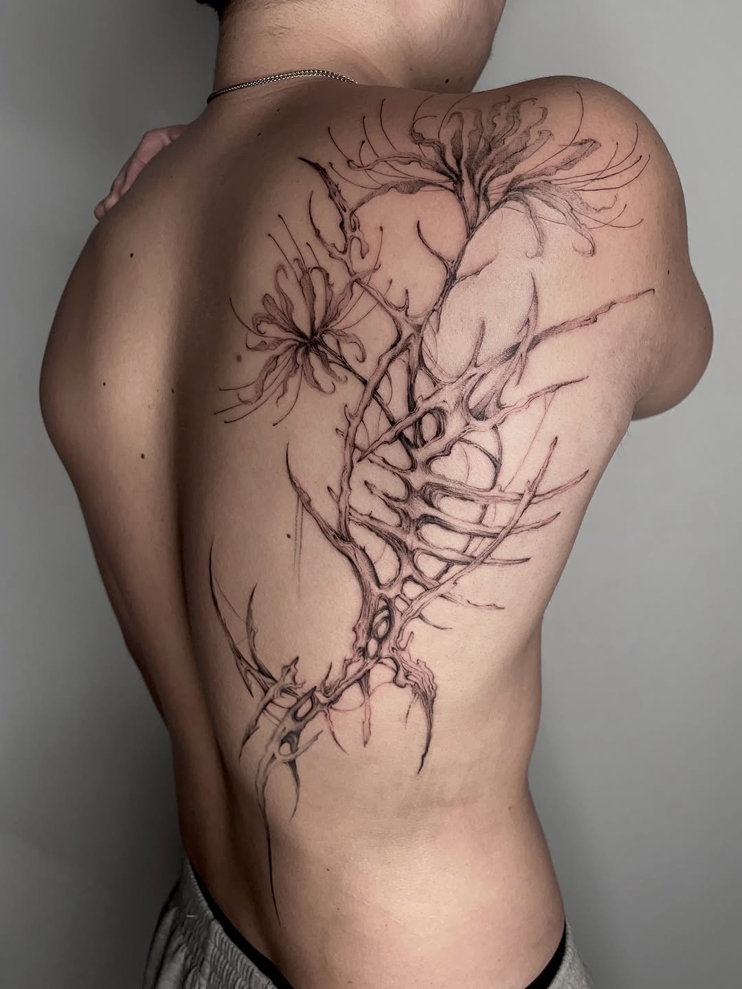 Tattoo by @rayzhu.tattoo — blackwork, illustrative