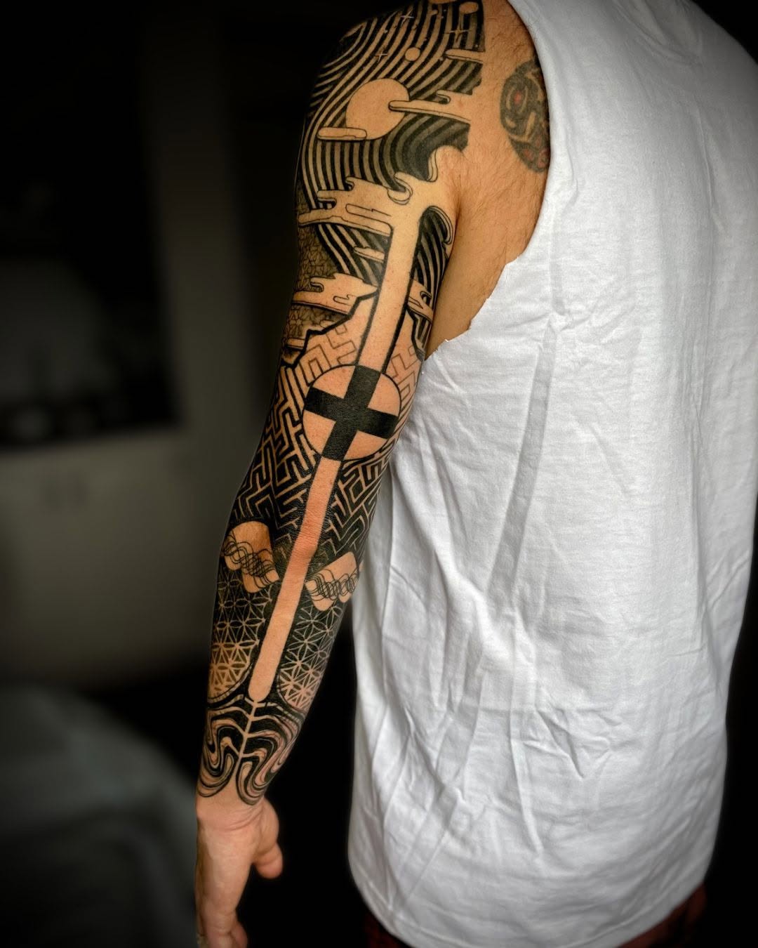 Tattoo by @dominic.pirro β geometric, blackwork