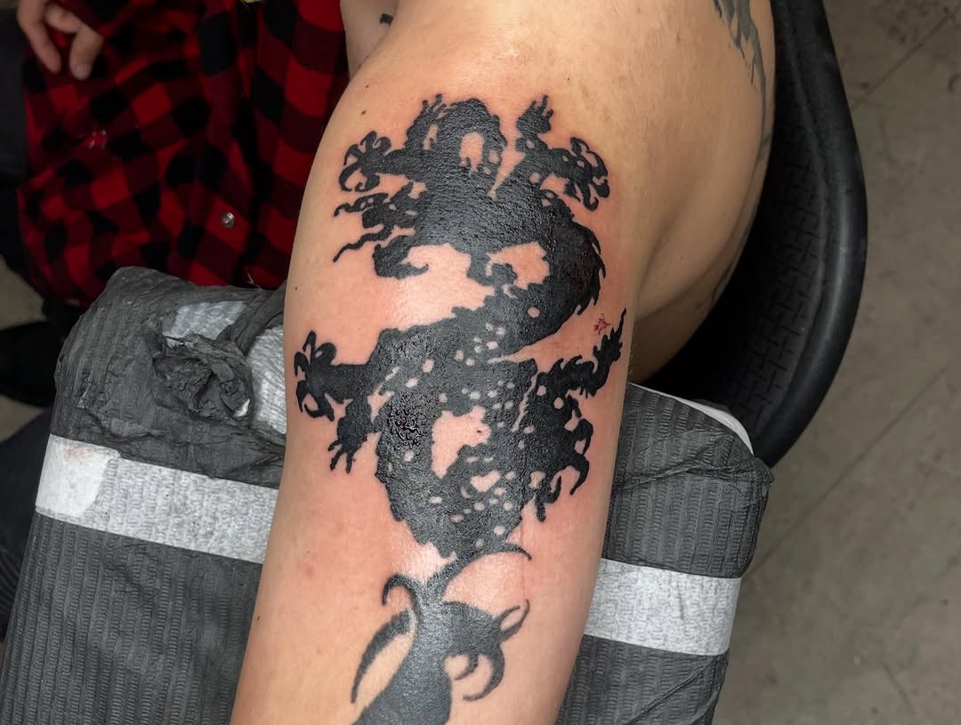 Tattoo by @emotionalthugtattoo — blackwork