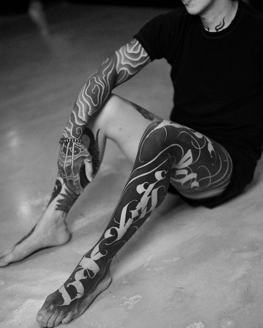 Tattoo by @low.original — blackwork, lettering_script
