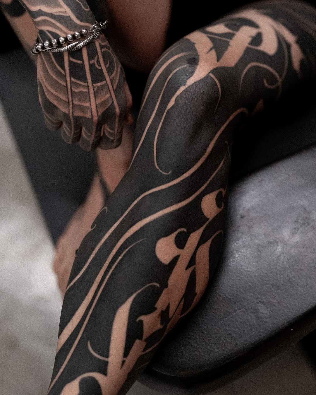 Tattoo by @low.original — blackwork, lettering_script