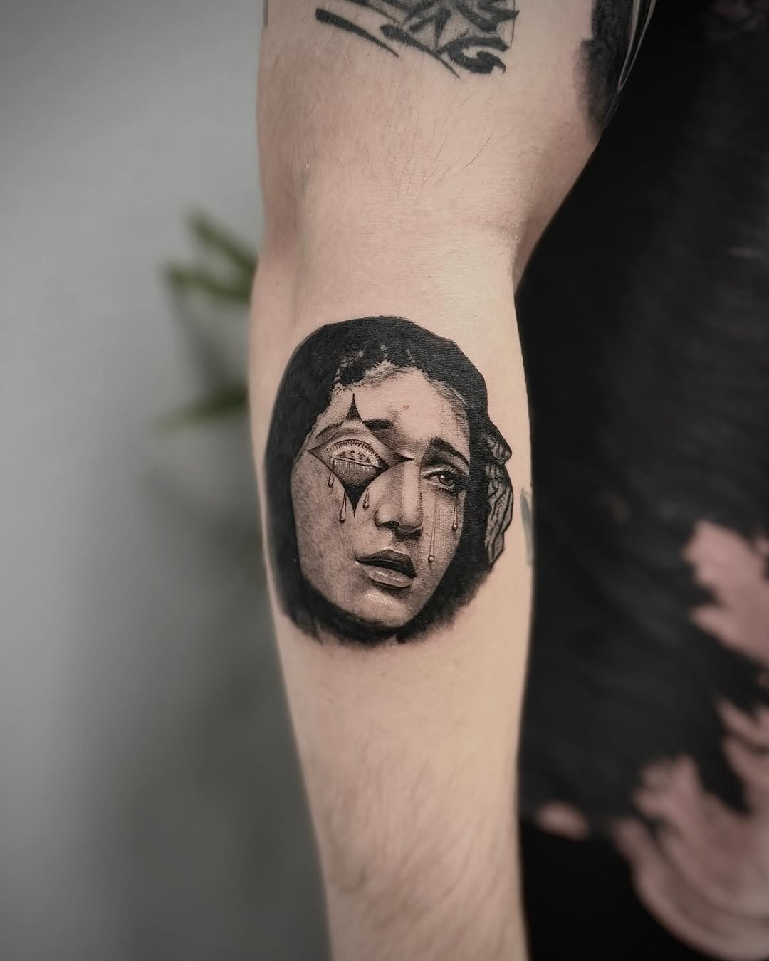 Tattoo by @janetatt.co — black_and_grey, realism