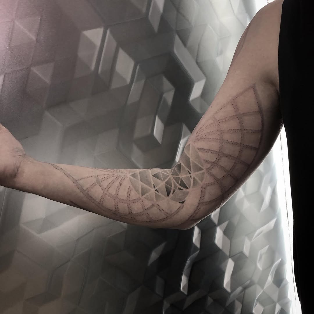 Tattoo by @golden.spiral.lola — geometric, dotwork