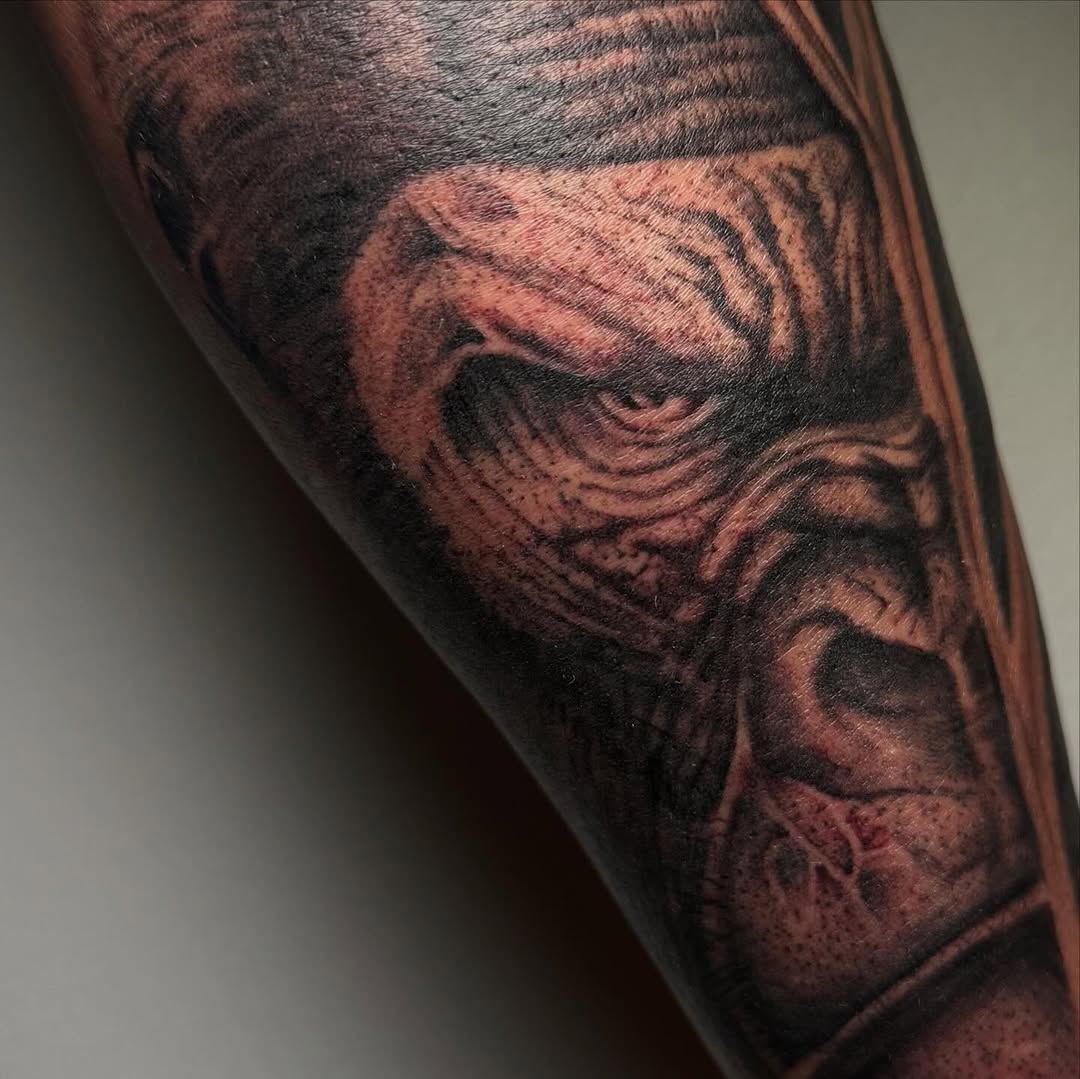 Tattoo by @rex.ink98 — realism, black_and_grey
