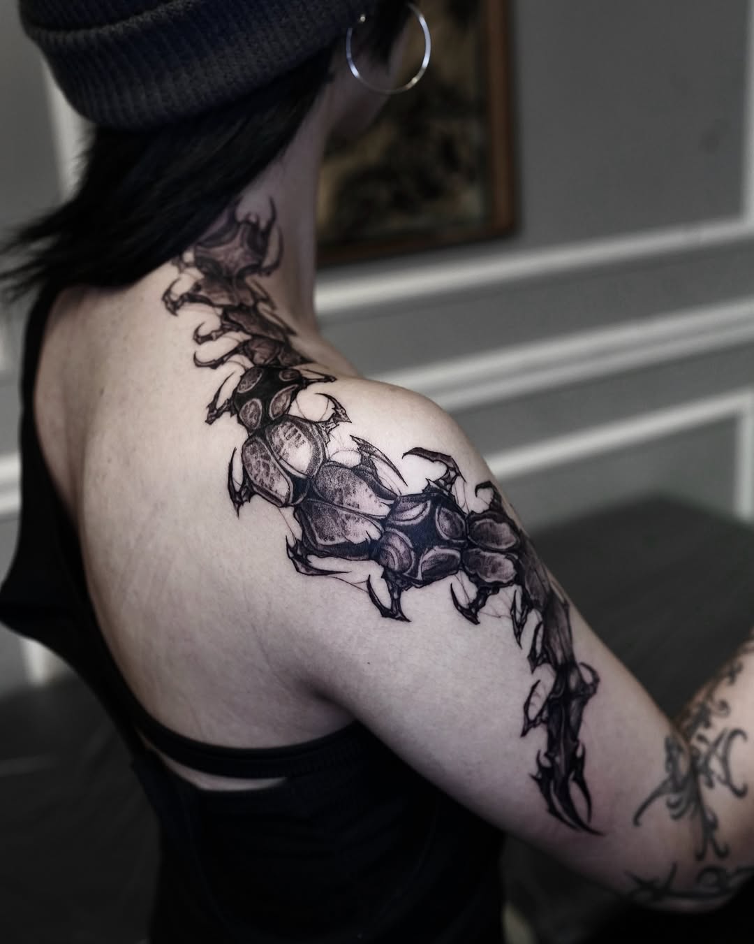 Tattoo by @gun_tattooist — black_and_grey, dark_realism