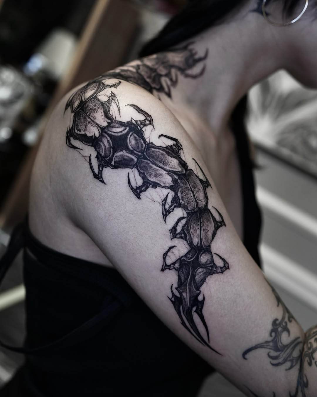 Tattoo by @gun_tattooist — black_and_grey, dark_realism